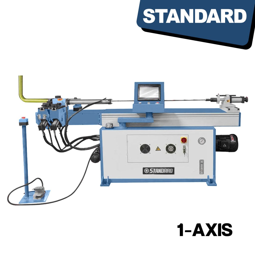 The STANDARD BTNC-89, 1-axis Hydraulic Mandrel Tube Bender is a machine with a metallic frame featuring various hydraulic components and controls. It has a long horizontal arm extending over a work surface where a tube is being bent. The machine includes digital displays, knobs, and levers for precise adjustments. The tube bending process is in progress, with the tube visibly curved around a central mandrel, showcasing the capabilities of the equipment.