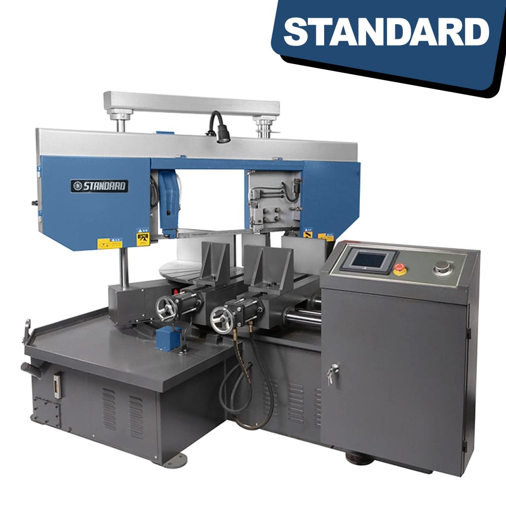 The STANDARD BMC-300 Automatic NC Swing Head Bandsaw is a metallic machine with various controls and a swinging blade head. It stands on a sturdy base with a vice to hold materials for cutting. The blade head can tilt to make angled cuts, and the control panel features buttons and knobs for adjusting settings like blade speed, feed rate, and head angle. The bandsaw is designed for cutting various materials such as metal, wood, or plastic.