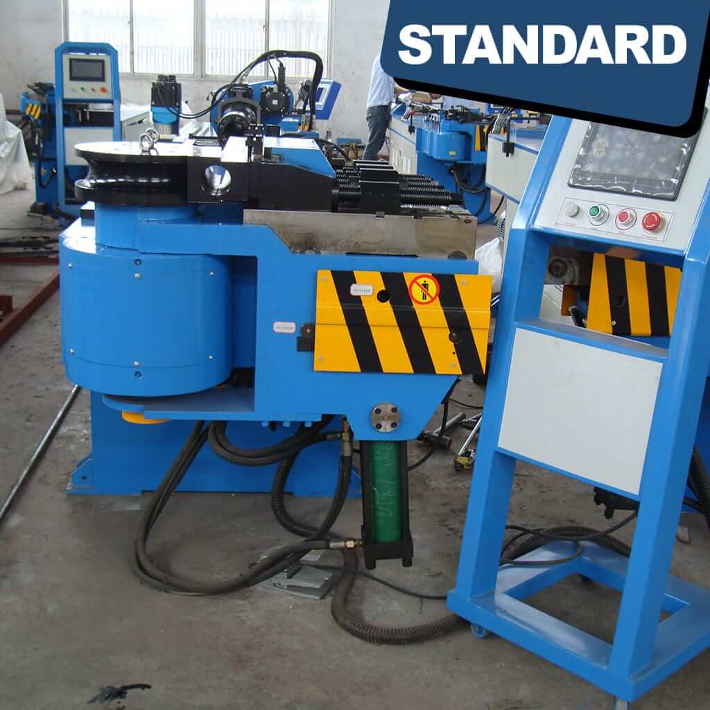 The control panel of the STANDARD BTS-89 3-Axis Servo Mandrel CNC Tube Bender displays a series of buttons, switches, and a digital interface for programming and controlling the bending process of metal tubing. The panel features various knobs and indicators for precise adjustments, facilitating the operation of the tube bending machine.