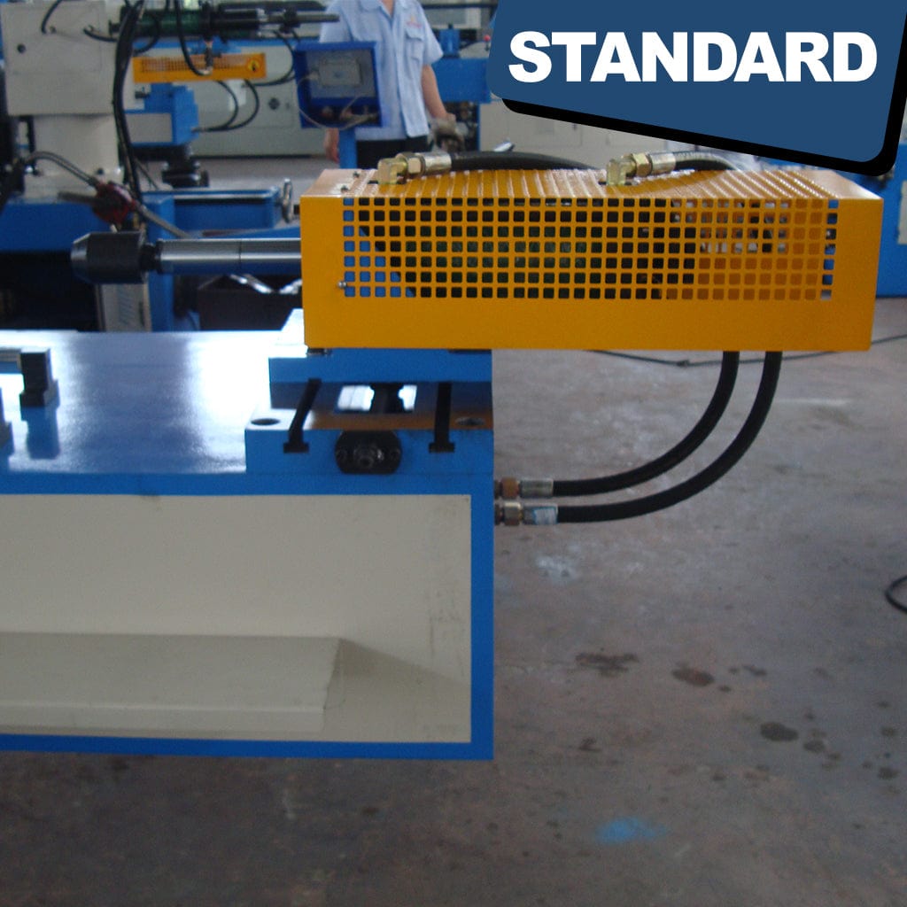 Safety guards, emergency stop buttons, and warning labels on the STANDARD BTS-89 3-Axis Servo Mandrel CNC Tube Bender ensure user protection. Guards shield moving parts, stop buttons halt operations in emergencies, and warning labels provide safety information.