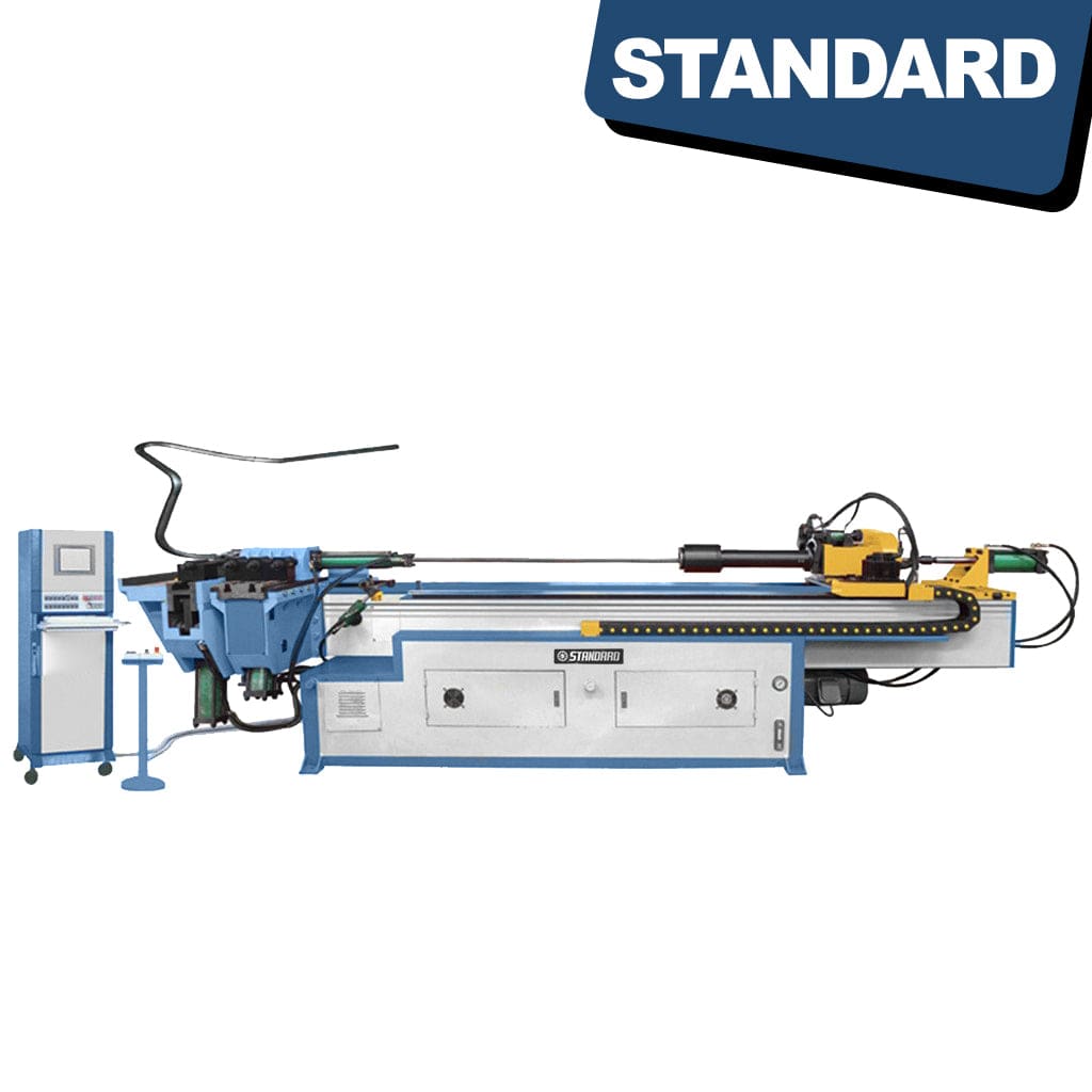 STANDARD BTH-100 3-Axis Hydraulic Mandrel CNC Tube Bender in a manufacturing setting. The machine has various metallic components, hydraulic cylinders, and a control panel displaying digital interface for programming. A tube is bent and shaped by the machinery.