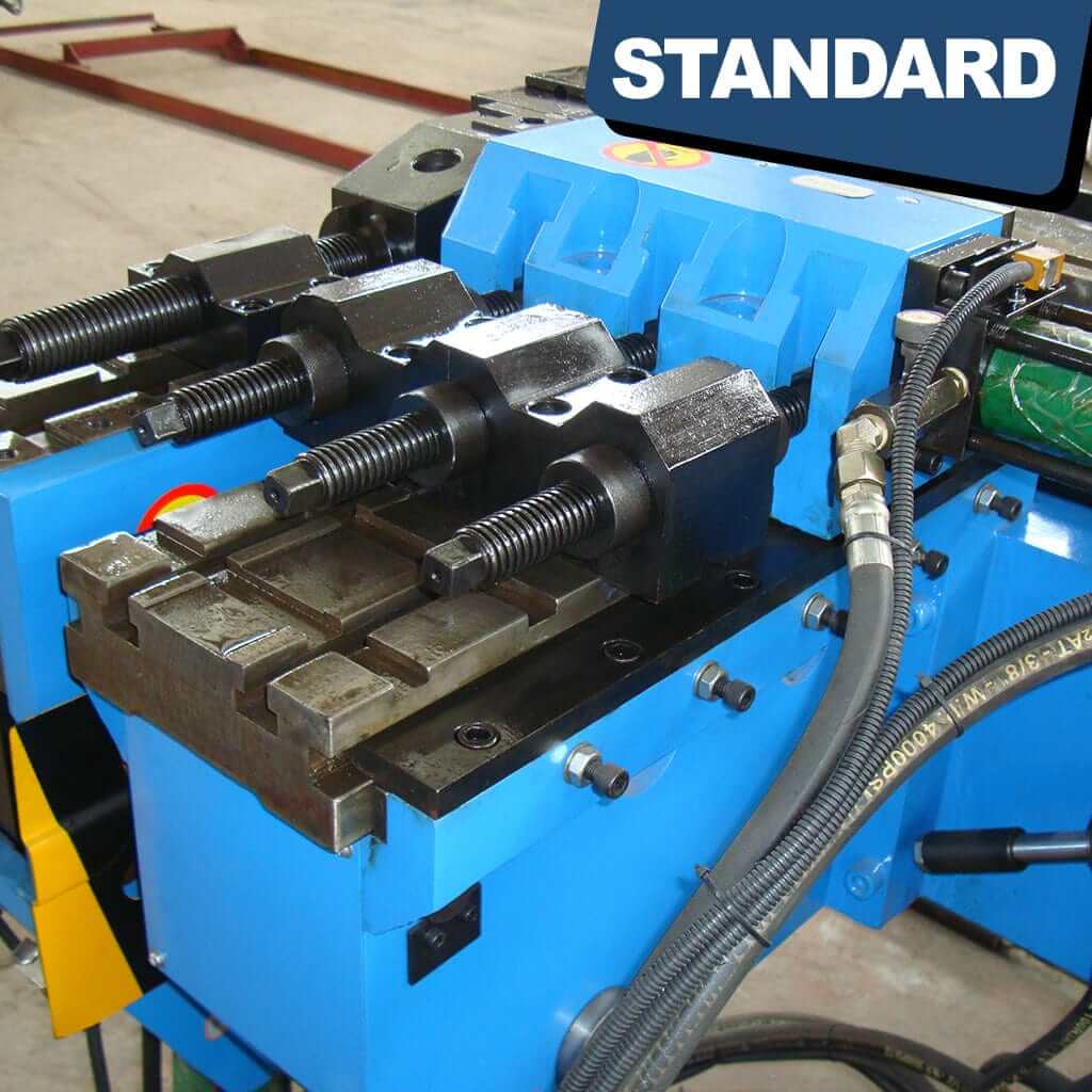 An image focusing on the tube clamping mechanism of the STANDARD BTS-38 3-Axis Servo Mandrel CNC Tube Bender, showcasing clamps securely holding a metal tube in place for precision bending.