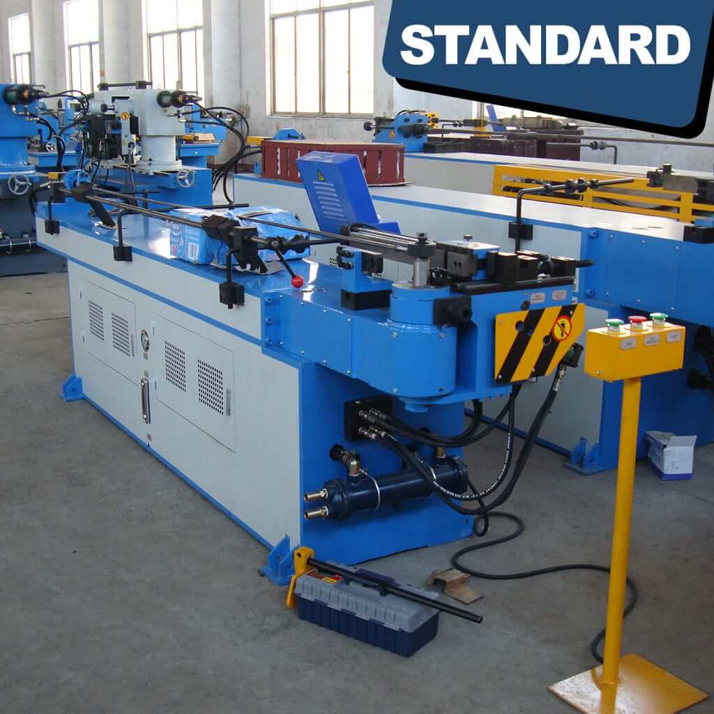 A control panel of the STANDARD BTNC-129, 1-axis Hydraulic Mandrel Tube Bender, displaying tactile knobs, levers, and a digital interface. The controls are labeled with raised, high-contrast markings for ease of identification. The panel allows for adjustment of bending parameters and operation of the tube bending machine.