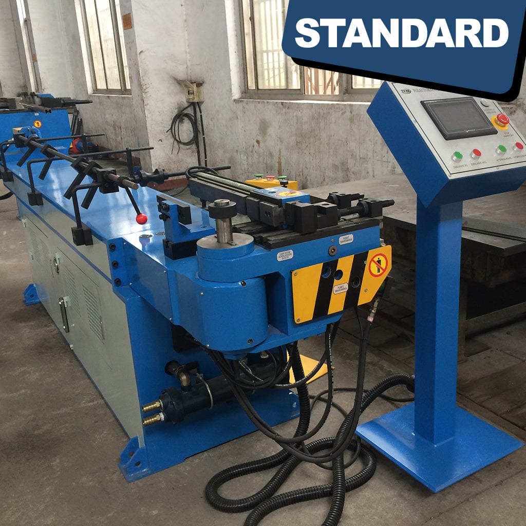 The control panel of the STANDARD BTNC-38, 1-axis Hydraulic Mandrel Tube Bender, features an array of buttons, switches, dials, and a digital interface. The control panel allows operators to set bending parameters, adjust angles, and manage the hydraulic functions required for tube bending. It showcases a user-friendly interface for precise control and monitoring of the bending process within an industrial setting.