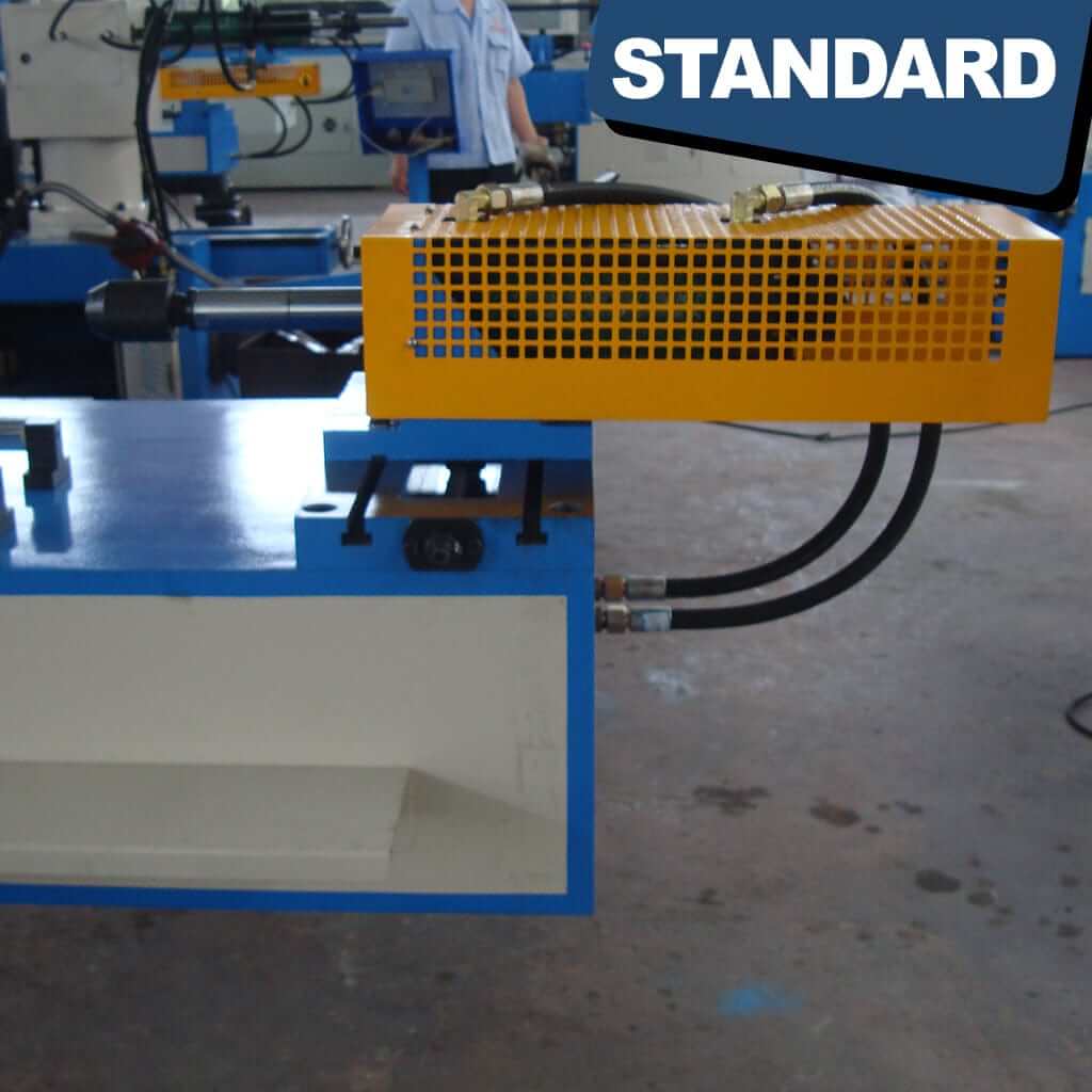 An image displaying the safety features of the STANDARD BTS-38 3-Axis Servo Mandrel CNC Tube Bender, including emergency stop buttons, protective guards, and safety sensors aimed at ensuring safe operation during tube bending processes.