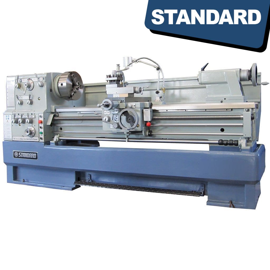  STANDARD T-510x1500 Solid Base Precision Lathe - A metallic lathe machine with a solid base, suitable for precision machining, featuring various controls and a long bed for workpieces.